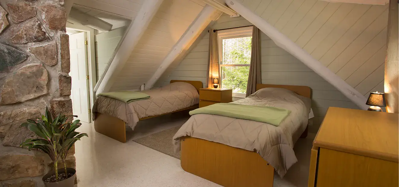 Shared patient bedroom at Green Mountain Treatment Center with two twin beds