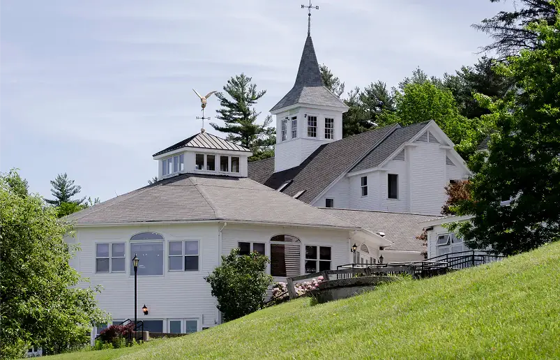 Green Mountain Treatment Center white building with cupola on grassy hill