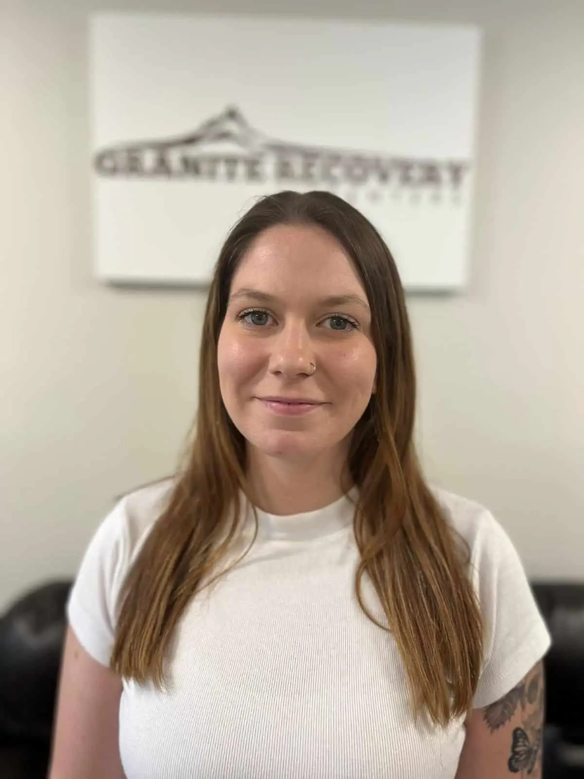 Granite Recovery staff member smiling in office